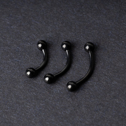 Three black curved barbells with threaded balls on each end, displayed on a dark background with a polished finish.