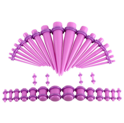 A pink and purple ear stretching kit featuring a complete set of tapers and plugs in various sizes, displayed on a white background.