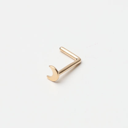 A gold-tone crescent moon nose stud with a curved design for secure and comfortable wear, displayed on a white background.