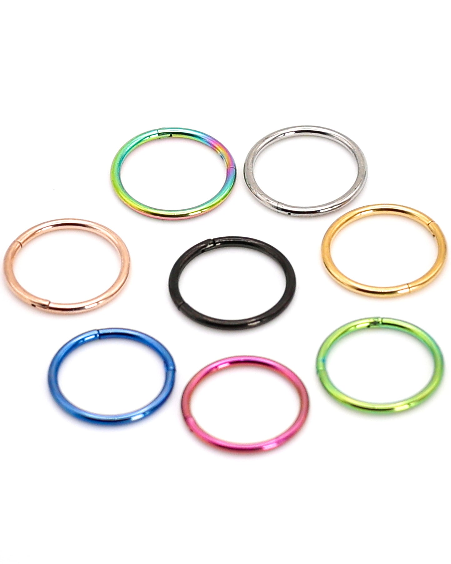 A display of 8 different coloured septum clickers